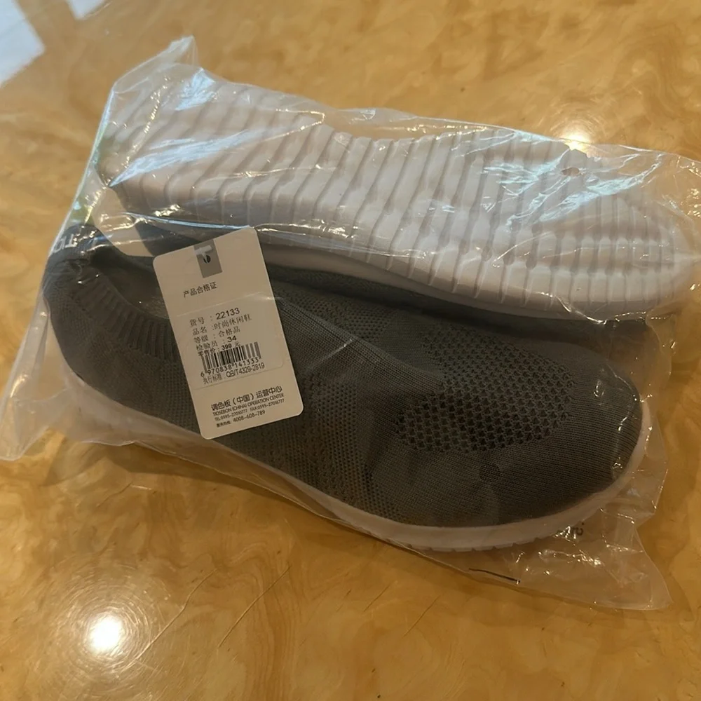 7W NWT-Gray and White Slip-On Sneakers with Knit Upper
